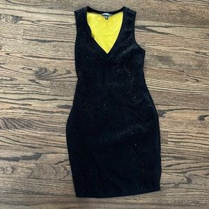 Never worn perfect condition beaded Bebe Dress with opening in back